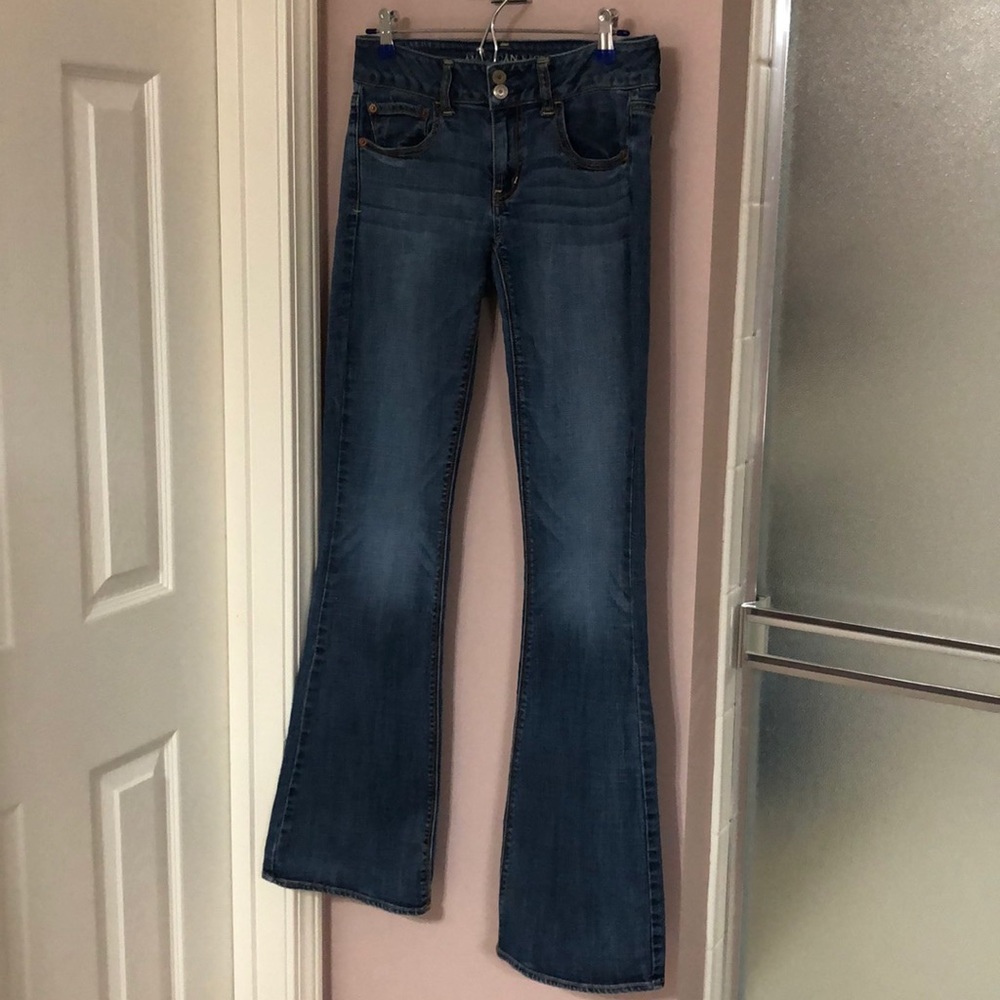 Medium wash AE Artist Super Stretch flare jeans